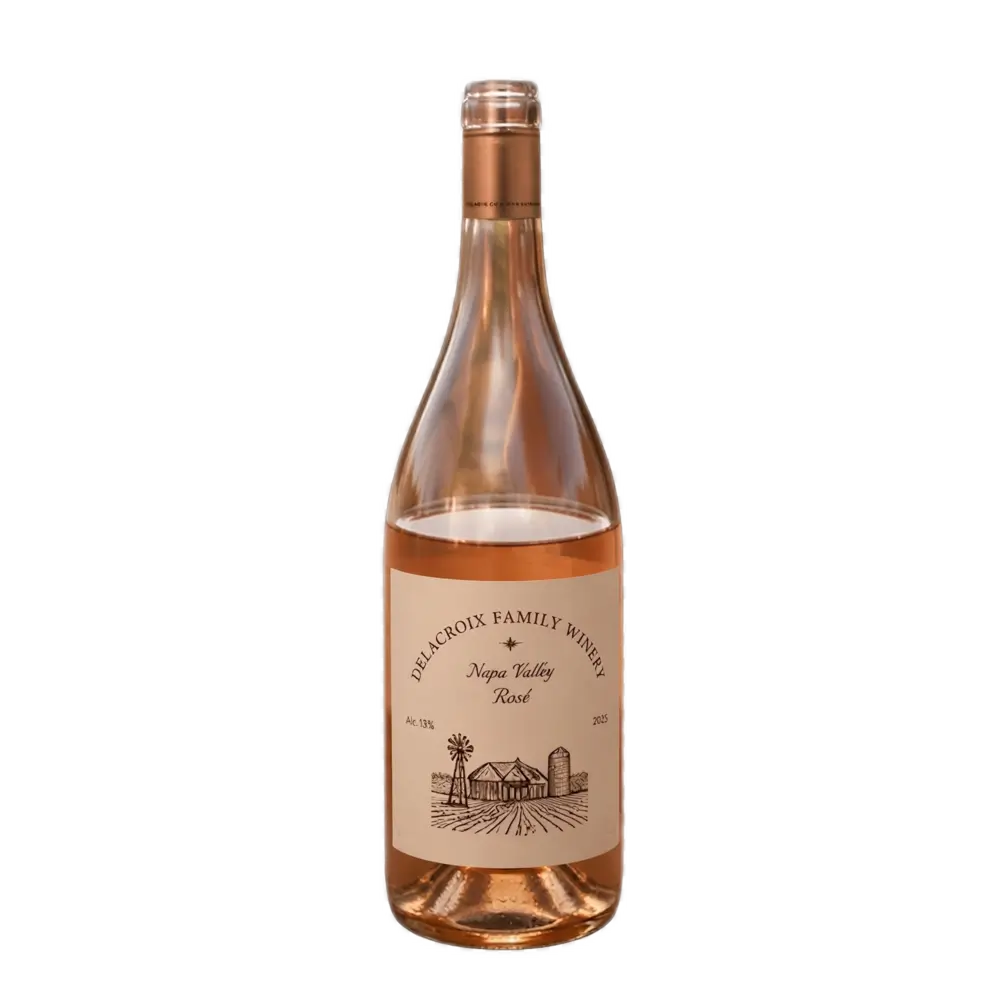 A centered photograph of a clear glass bottle filled with rosé wine. The cream-colored label reads "Delacroix Family Winery", "Napa Valley Rosé", and includes an illustration of a farmstead with a windmill and silo, along with details like "Alc. 13%" and "2025". The background is a grey and white checkerboard pattern.